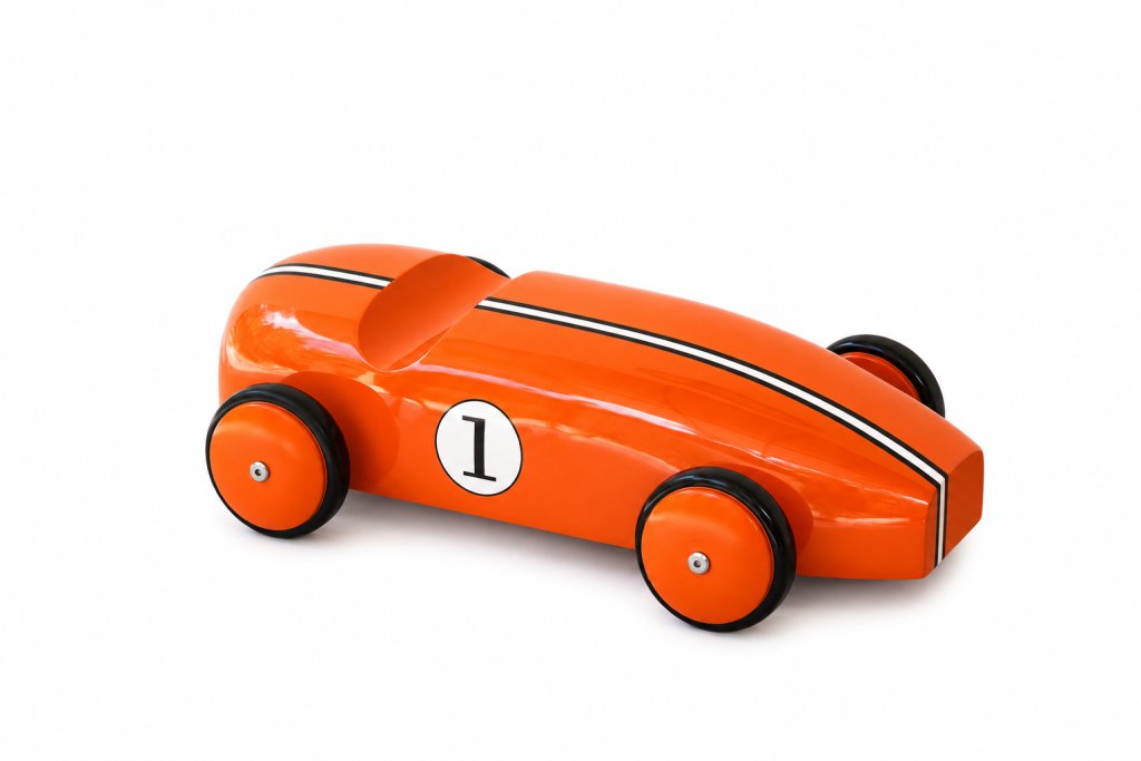 Orange lacquered teak race car